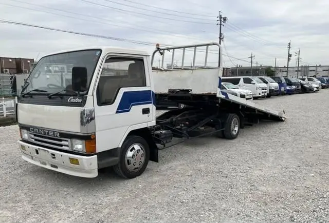 2015 Mitsubishi Canter Carrier, white — photo 1 of 4