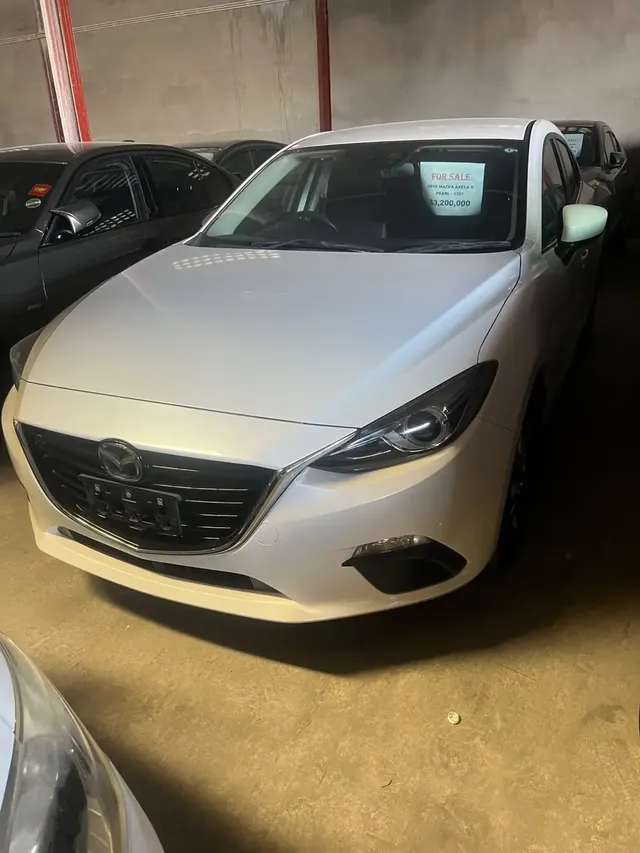 2015 Mazda Axela, white hatchback for sale at Rahaman & Sons, Success — in stock