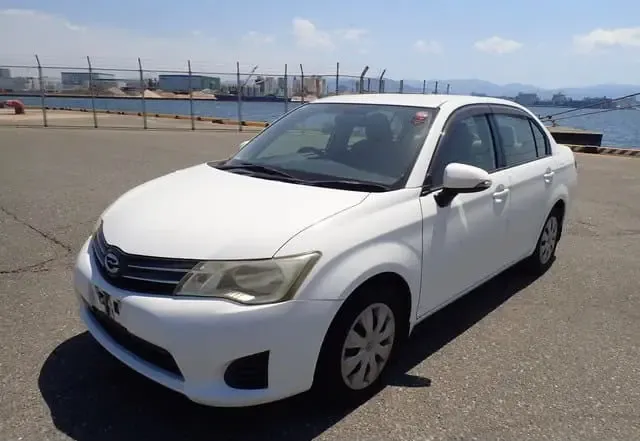 2013 Toyota Corolla Axio, silver sedan for sale at Rahaman & Sons, Success — arriving soon
