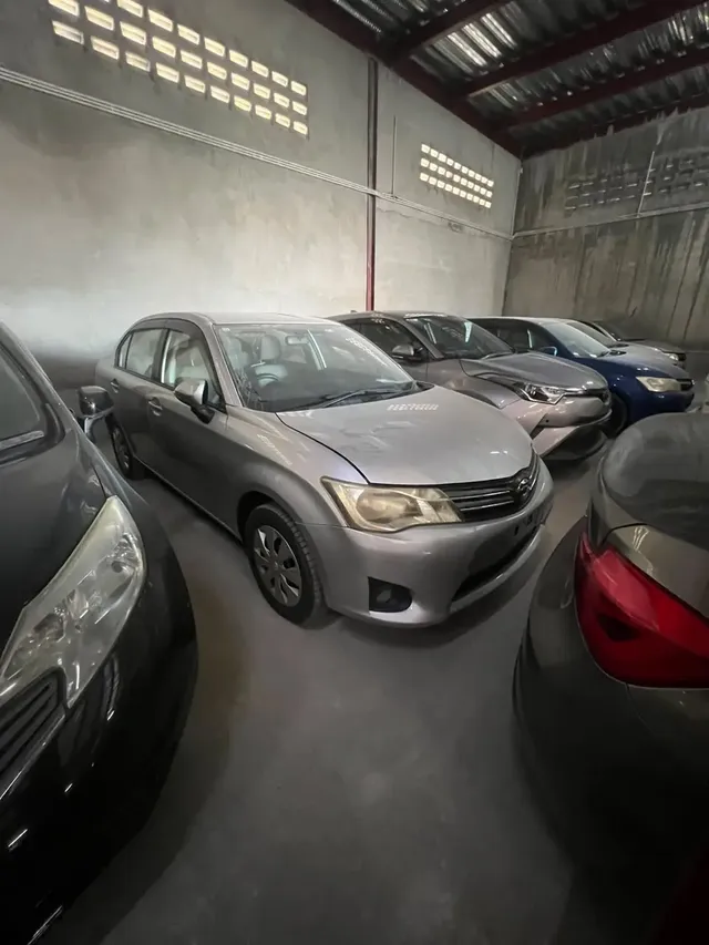 2013 Toyota Corolla Axio, silver sedan for sale at Rahaman & Sons, Success — in stock