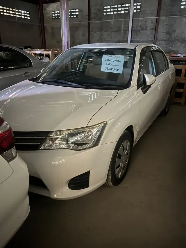 2014 Toyota Corolla Axio, white sedan for sale at Rahaman & Sons, Success — in stock